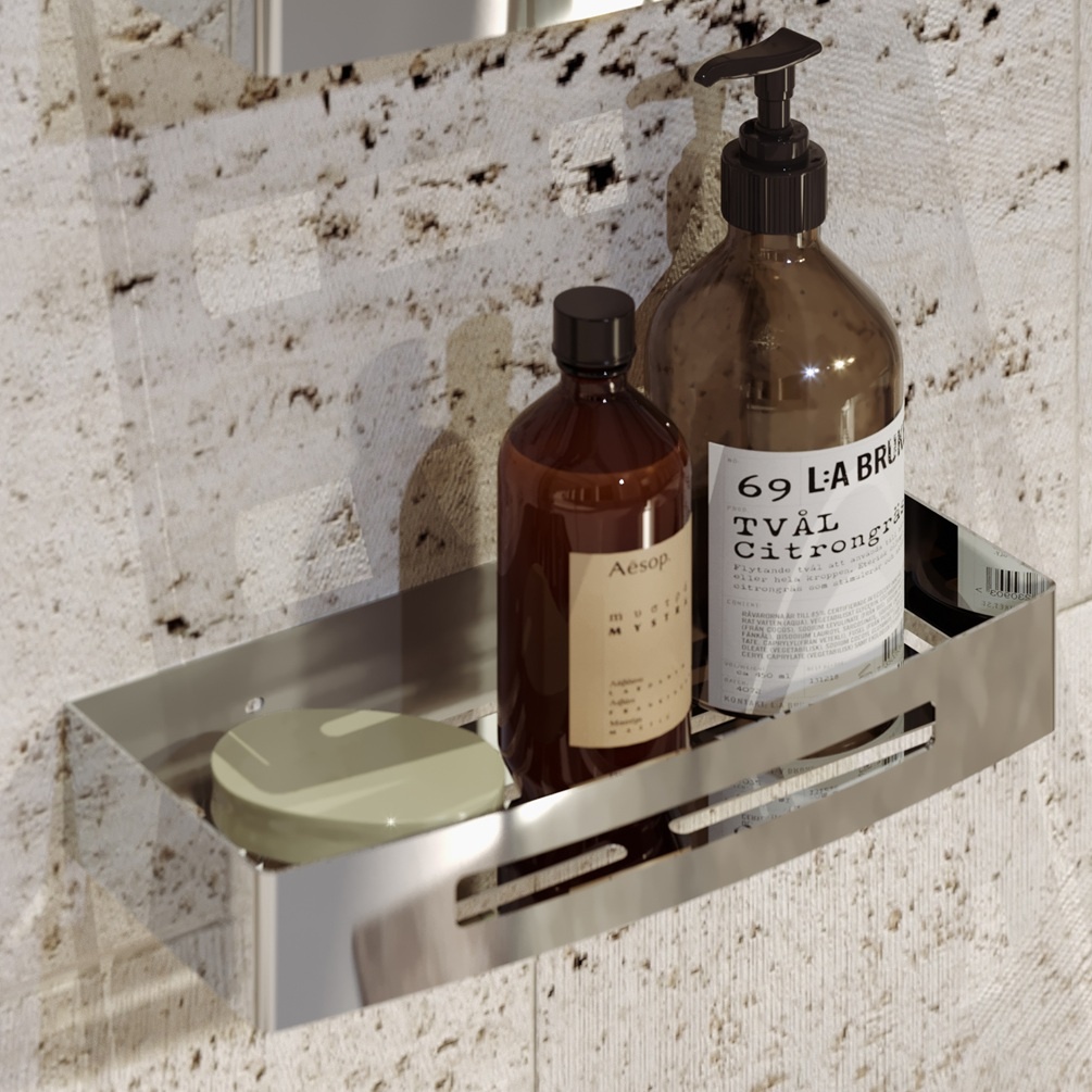 close up lifestyle image of origins living nerva chrome shower basket fitted to wall with bottles inside