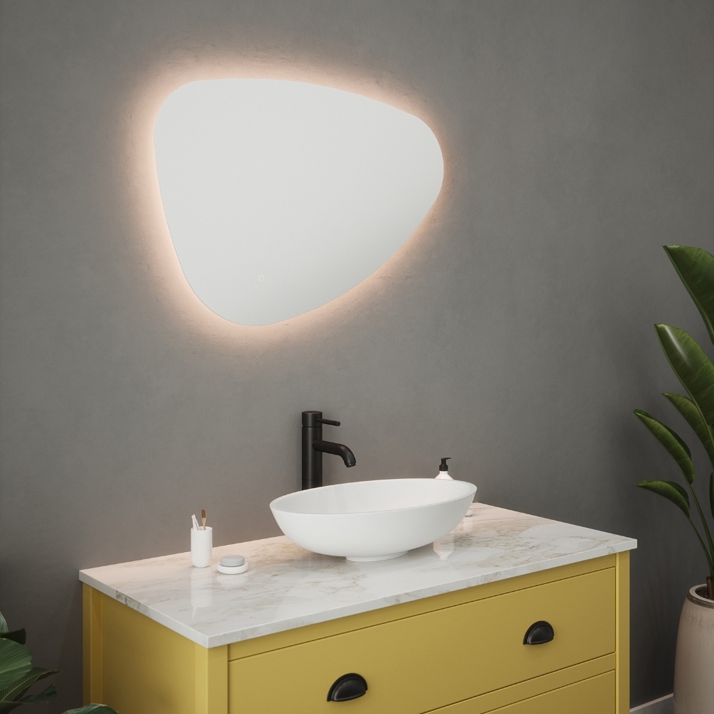 Product Lifestyle image of the Pebble Backlit Colour Changing LED Mirror mounted in landscape