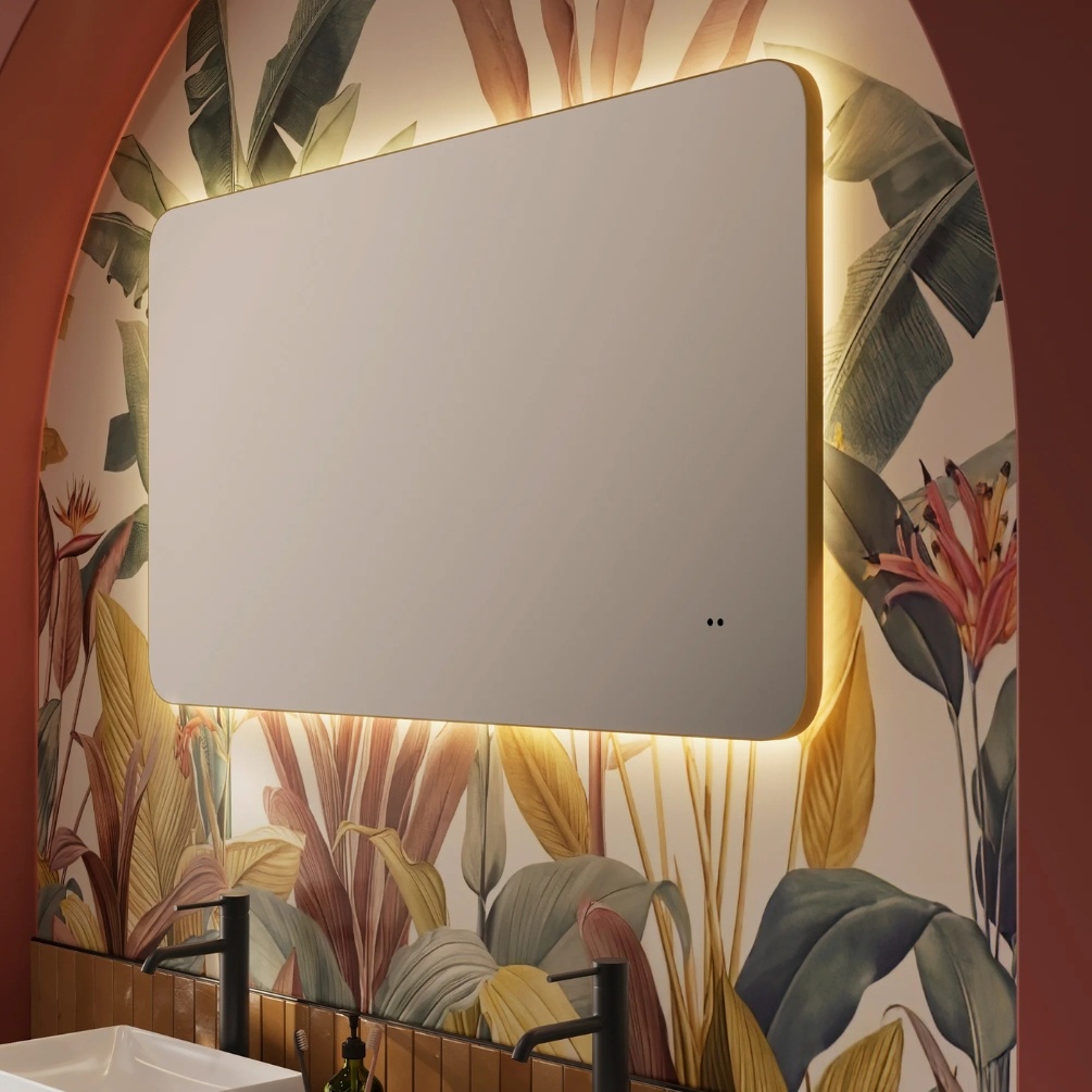 Close up lifestyle image of the hib. Arcane Curve 1200mm x 700mm Brushed Brass Illuminated Frame Mirror