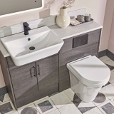 Lifestyle image of the Tavistock Aerial Back To Wall Comfort Height Toilet attached to a vanity unit