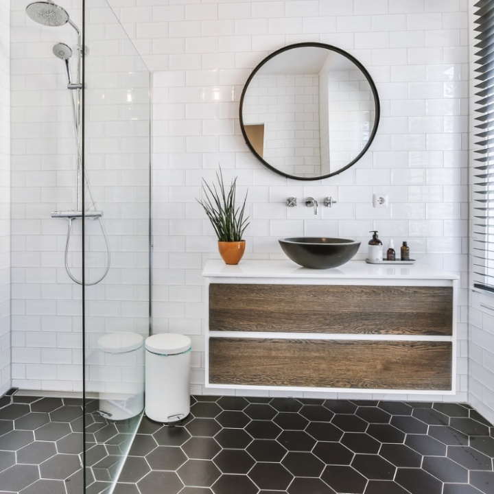 Lifestyle image of a wall hung washbasin unit with walnut brown drawers