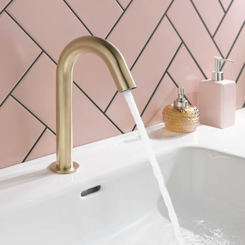 Close up product lifestyle image of the JTP Sensor Brushed Brass Basin Mixer