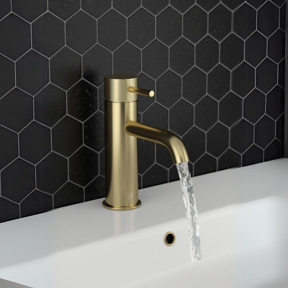 Close up product lifestyle image of the JTP Vos Brushed Brass Basin Mixer with Designer Knurled Handle