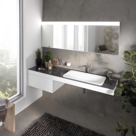 image of keuco edition 400 triple recessed cabinet with door above wall mounted basin and worktop next to window
