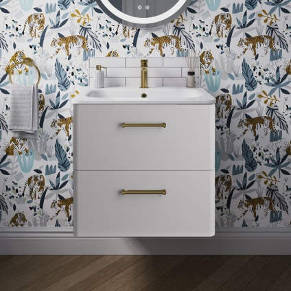 Product lifestyle image of Britton Bathrooms Camberwell Frosted White Wall Hung Vanity Unit with Basin in Bathroom with brass handles and tap wide shot