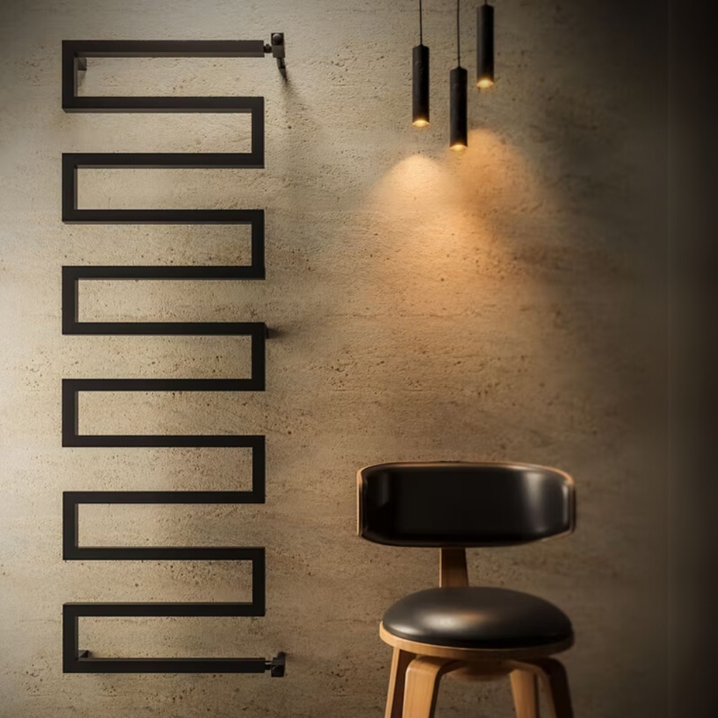 Lifestyle image of the Radox Serpentine 1570mm x 500mm Matt Black Designer Towel Rail mounted on a bathroom wall