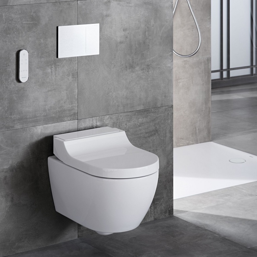 Product Lifestyle Image in Grey Bathroom of Geberit AquaClean Tuma Comfort Smart Wall Hung Bidet Shower Toilet in Alpine white - 146.290.11.1