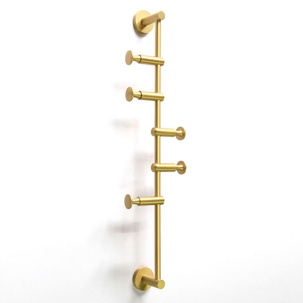 Lifestyle image of Origins Living Archer Vertical Rail satin brass.