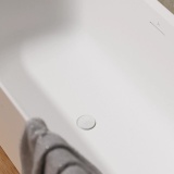 Lifestyle image of Crosswater Matt White Unslotted Clearstone Click-Clack Bath Waste