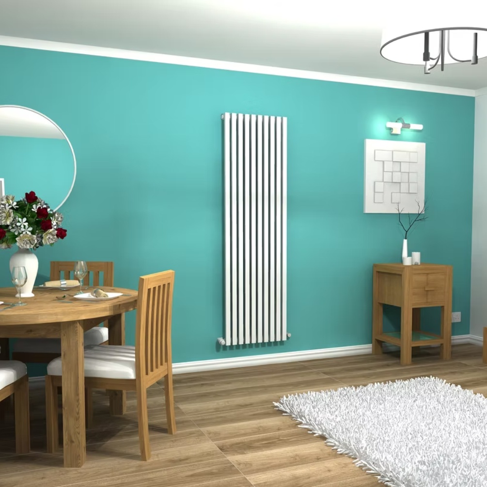 Lifestyle image of the CO Radox Vertica D 1800mm x 535mm White Vertical Radiator mounted on a blue wall