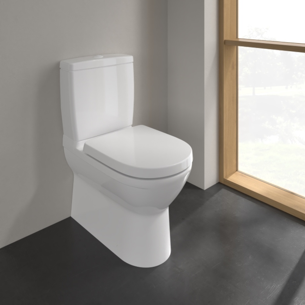 Lifestyle image of Villeroy & Boch O.Novo Close Coupled Back to Wall Toilet in bathroom with soft close seat and cistern