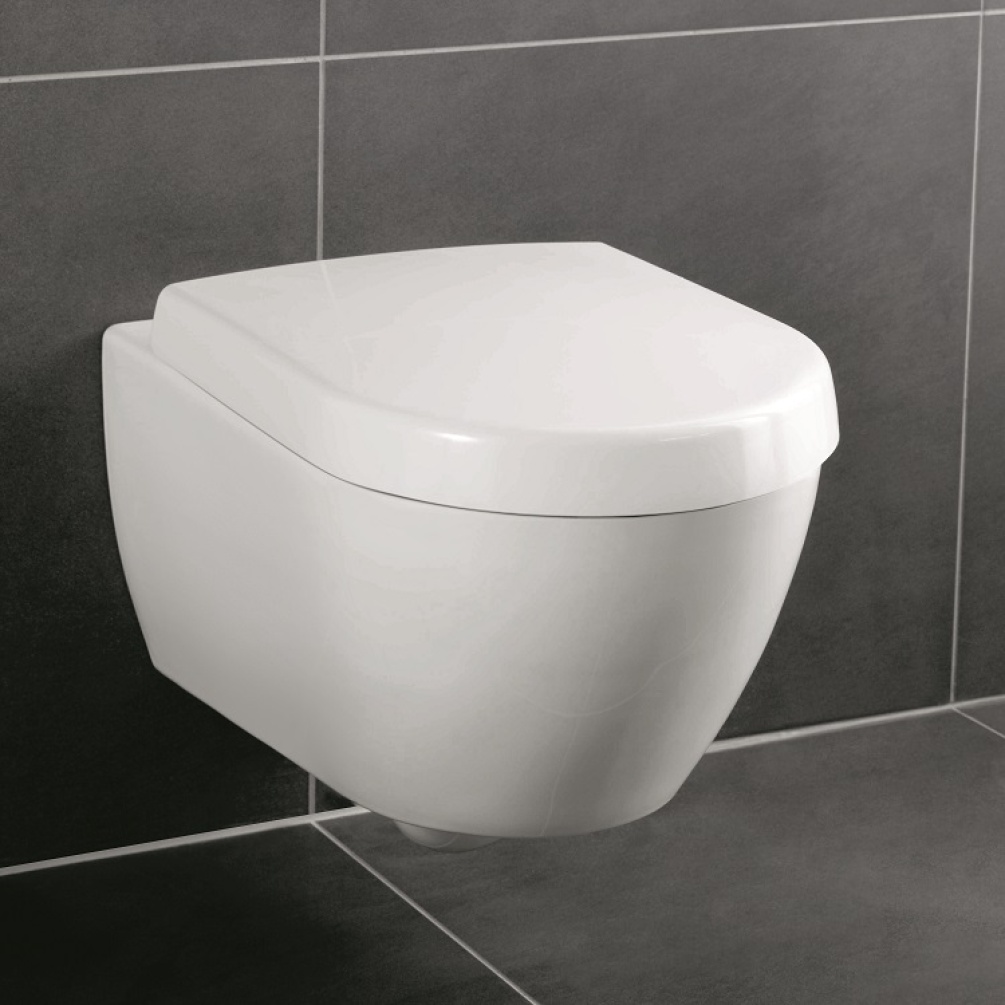 Product lifestyle photo of Villeroy and Boch Subway 2.0 Washdown Wall Hung Toilet front angle with large grey tiles 56001001