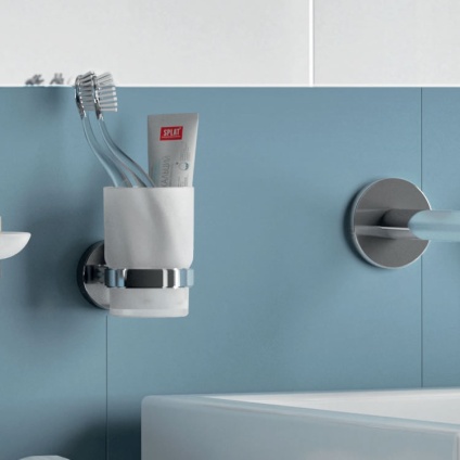 Lifestyle image of Origins Living G Pro Tumbler Holder Chrome mounted on blue and white tiled wall..