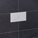 Close up Lifestyle image photo of Villeroy and Boch ViConnect E300/300S White Dual Flush Button Plate in blue bathroom