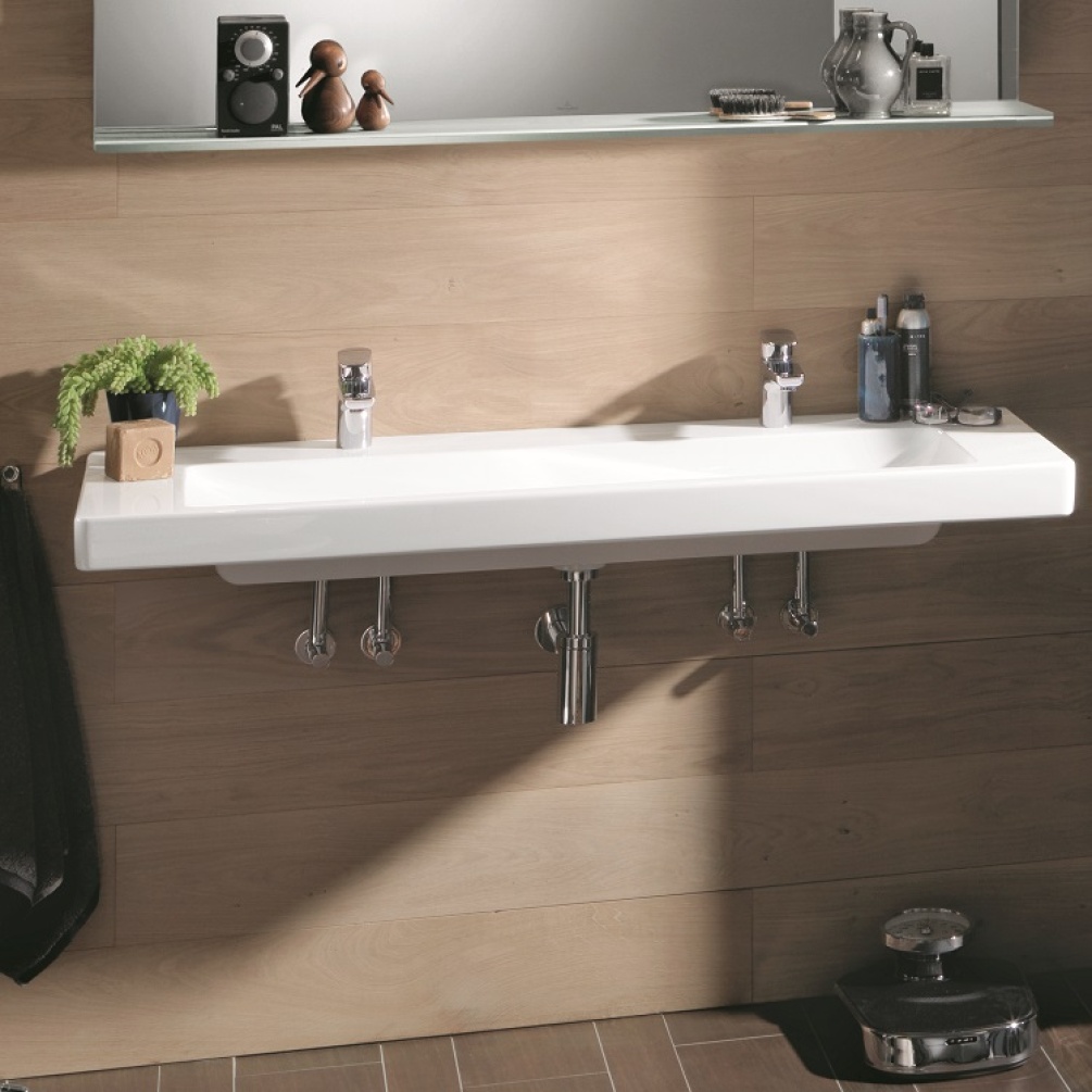 Product Lifestyle image of Villeroy and Boch 2 tap hole 1300mm Subway 2.0 Vanity Basin wall mounted on wooden wall, left angle 7176D201