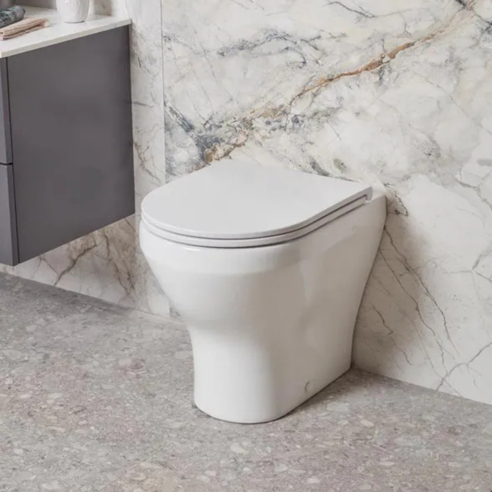 Lifestyle image of the Tavistock Micra Evo Back to Wall Comfort Height Toilet