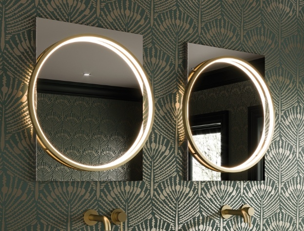 An Art Deco inspired set of vanity units and round mirrors in a green bathroom with floral motif wallpaper