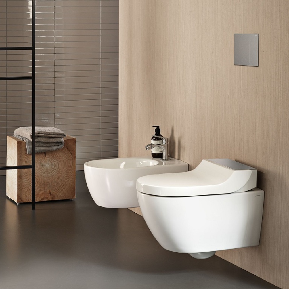 Product Lifestyle Image in Beige Bathroom with Bidet of Geberit AquaClean Tuma Comfort Rimless Wall Hung Stainless Steel Shower Toilet 146.290.FW.1