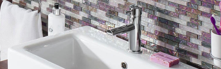Close up lifestyle image of a mixer tap mounted to a basin