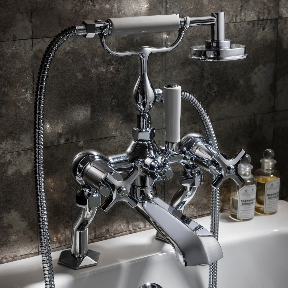 Lifestyle image of the Crosswater Waldorf Chrome Deck Mounted Crosshead Bath Shower Mixer installed on the deck of a white bathtub