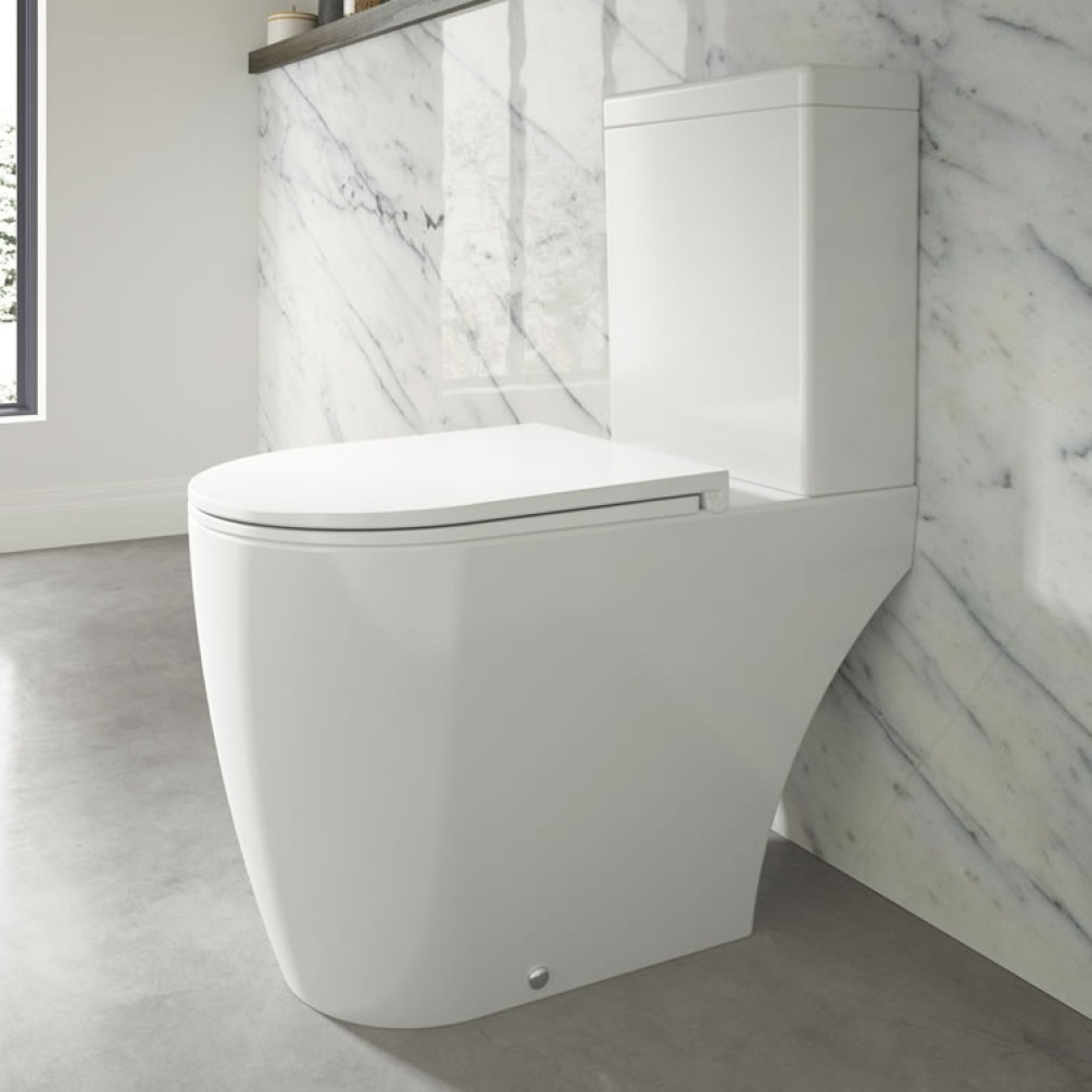 Photo of the The White Space Lab Rimless Close Coupled WC (Open Back) with Slim Soft Close Seat and Marbled Tiled Wall