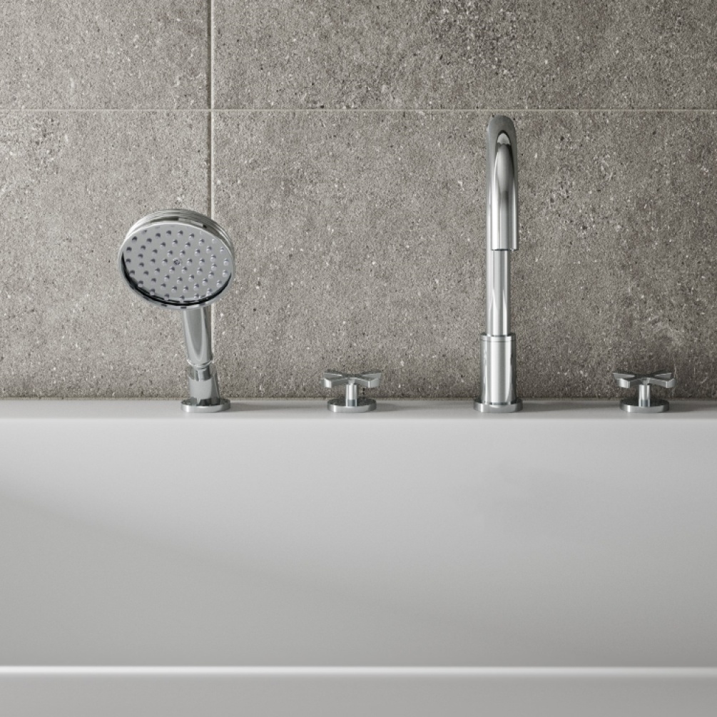 Close up product lifestyle image of Burlington Riviera 4 Tap Hole Bath Shower Mixer with Handset in bathroom with grey tiled background