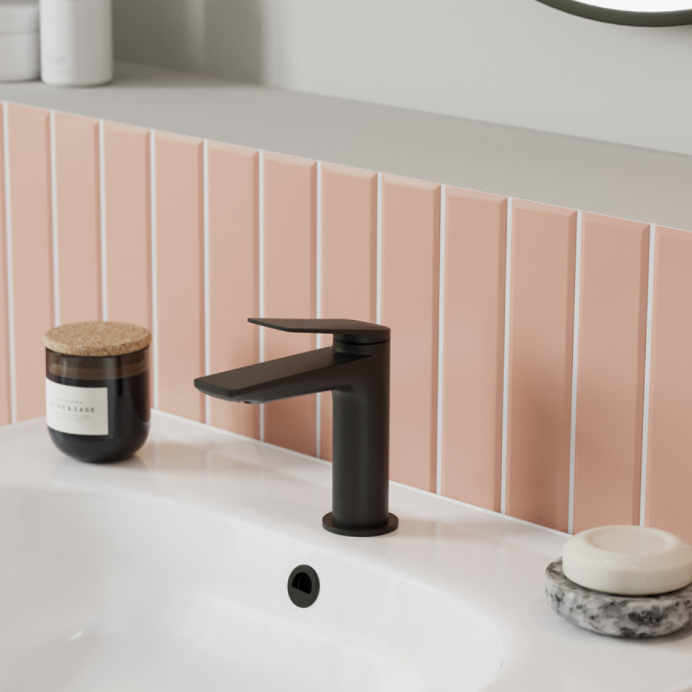 Photo of the Greenwich Basin Mixer in Matt Black with light pink tiles