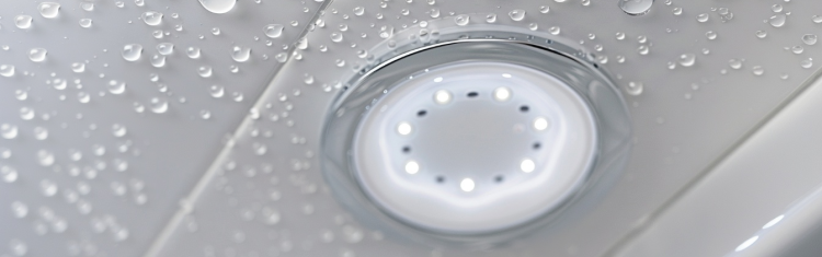 Image of a bathroom ceiling light with water droplets