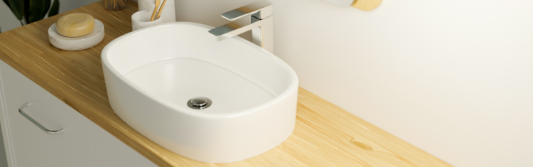 countertop basin on light wood worktop and vanity unit