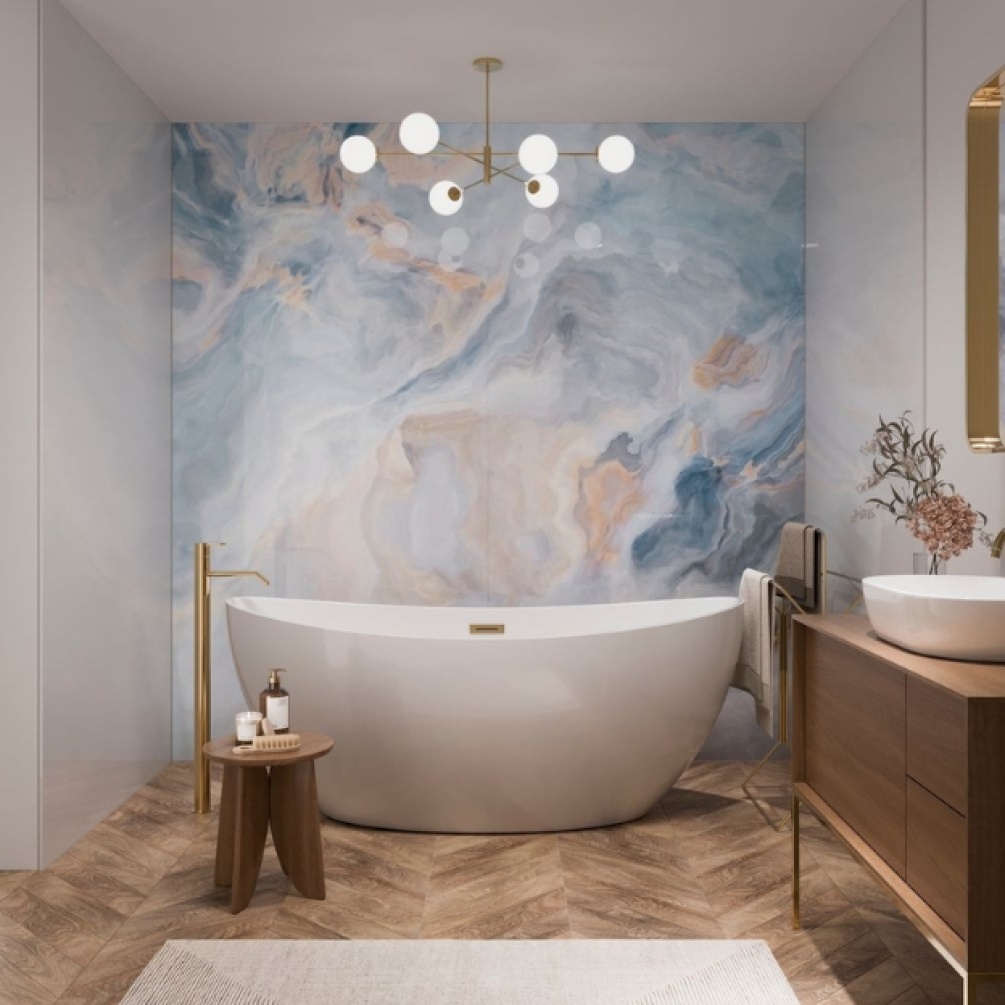 Lifestyle image of the Showerwall Acrylic Onyx Crystal 2400mm x 896mm Wall Panel - SCA69 installed on a wall behind a freestanding curved bathtub with freestanding bath mixer tap