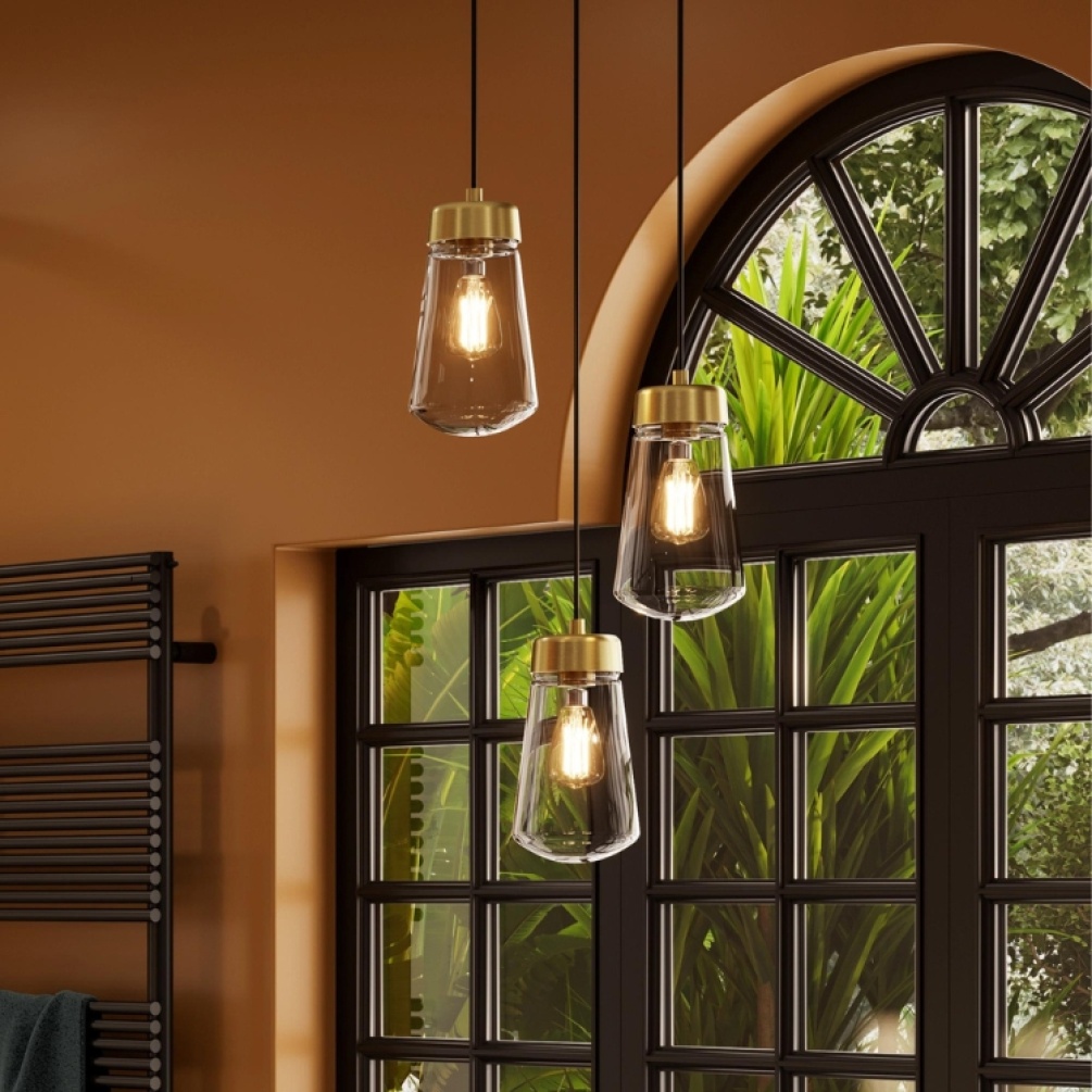 Product Lifestyle image of three HIB Summit Brushed Brass LED Pendant Lights