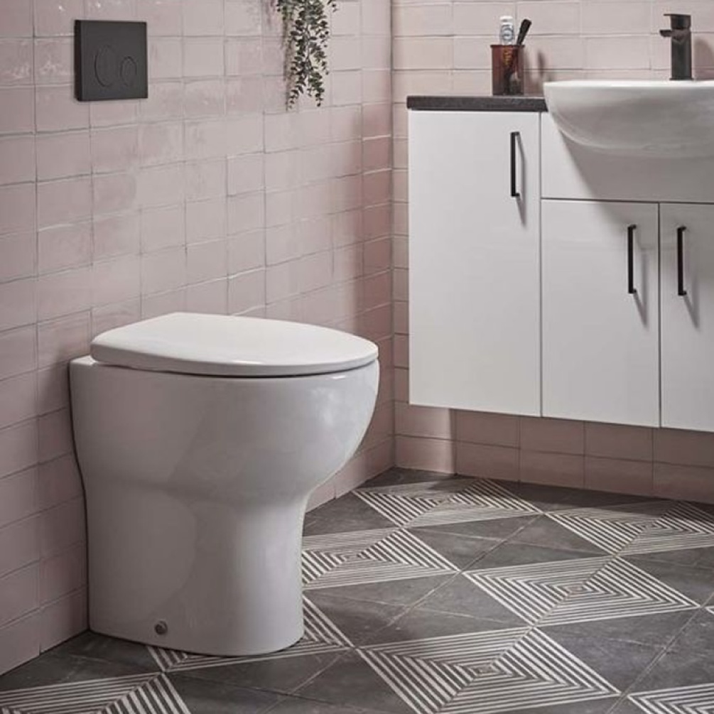 Lifestyle image of the Tavistock Loft Back to Wall Comfort Height Rimless Toilet