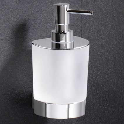Lifestyle image of Origins Living Gedy Kent Soap Dispenser mounted on dark grey textured tiles.