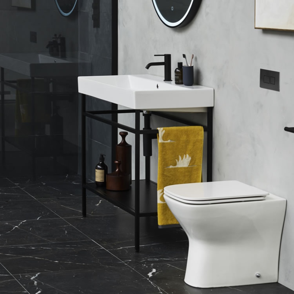 Photo of the Shoreditch Frame 700mm Furniture Stand in Matt Black with matt black accessories and black marble floor tiles