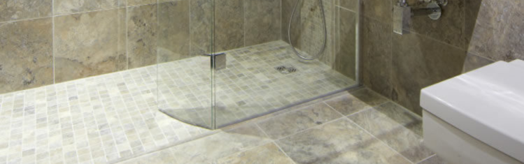 Close up product lifestyle image of a wetroom with the Abacus Elements 1400mm x 900mm Level Access 30mm Shower Tray Kit with End Drain