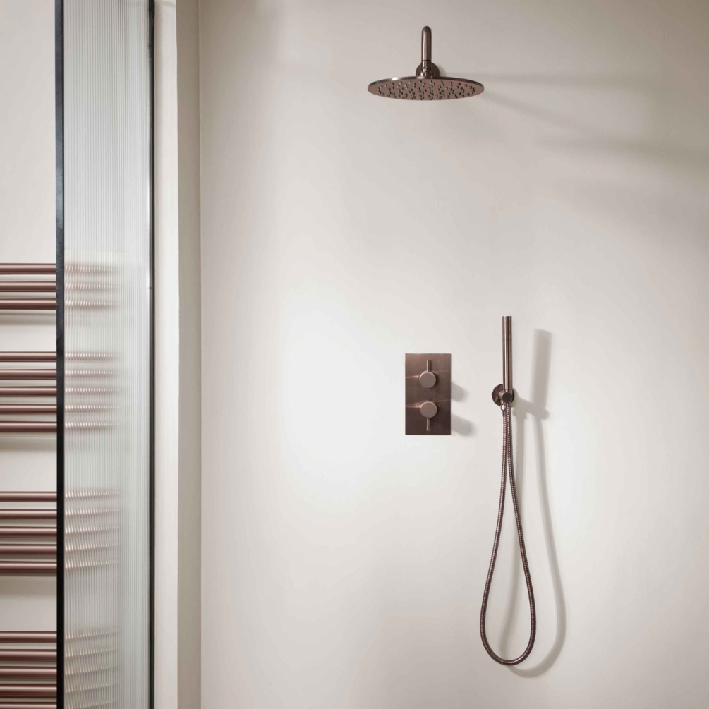 Product Lifestyle image of the JTP Vos Brushed Bronze 2 Outlet 2 Handle Shower Pack with Fixed Head & Handset