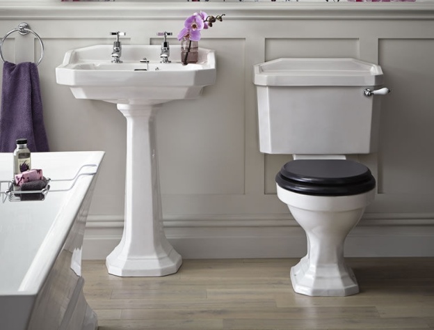 Product Lifestyle image of a Heritage Granley Deco Close Coupled Toilet and Landscape Cistern next to a Heritage Granley Deco 550mm Basin and Pedestal