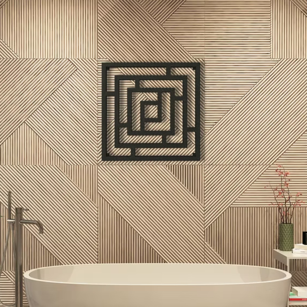 Lifestyle image of the Radox Maze 690mm x 690mm Black Pearl Designer Heated Radiator mounted on a contemporary bathroom wall, above a freestanding round bath and bath filler.