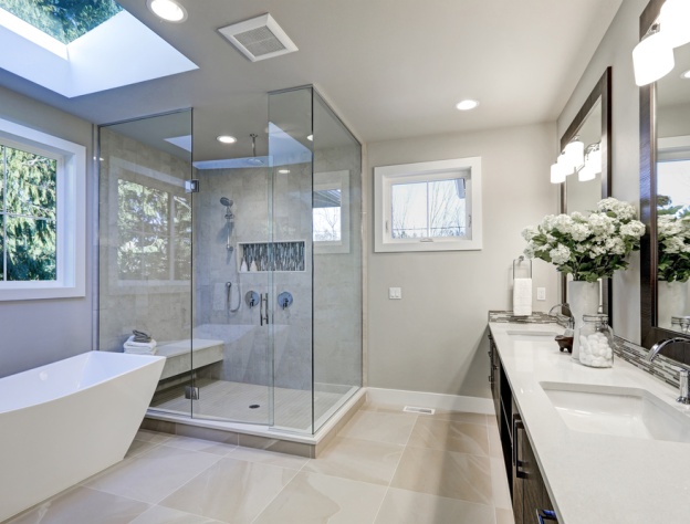 Lifestyle image of a bathroom featuring a large glass shower enclosure