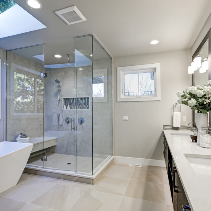 Lifestyle image of a bathroom featuring a large glass shower enclosure
