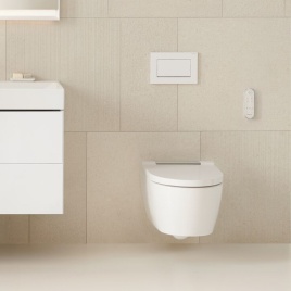 Product lifestyle image of a Geberit wall hung toilet in a beige tiled bathroom