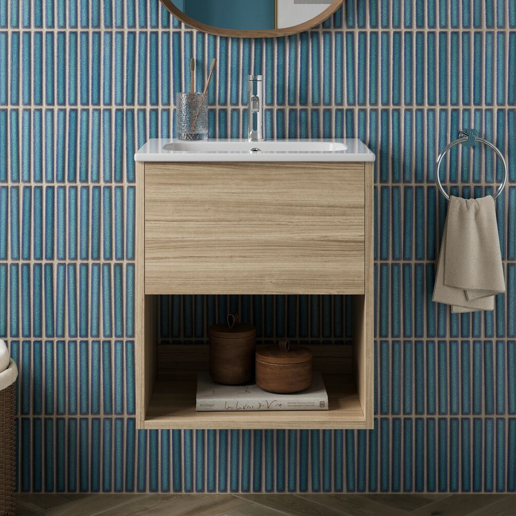 Lifestyle image of the Britton Hackney Cherry Wood 500mm Wall Hung Vanity Unit & Basin mounted on a tiled bathroom wall with basin mixer and towel ring