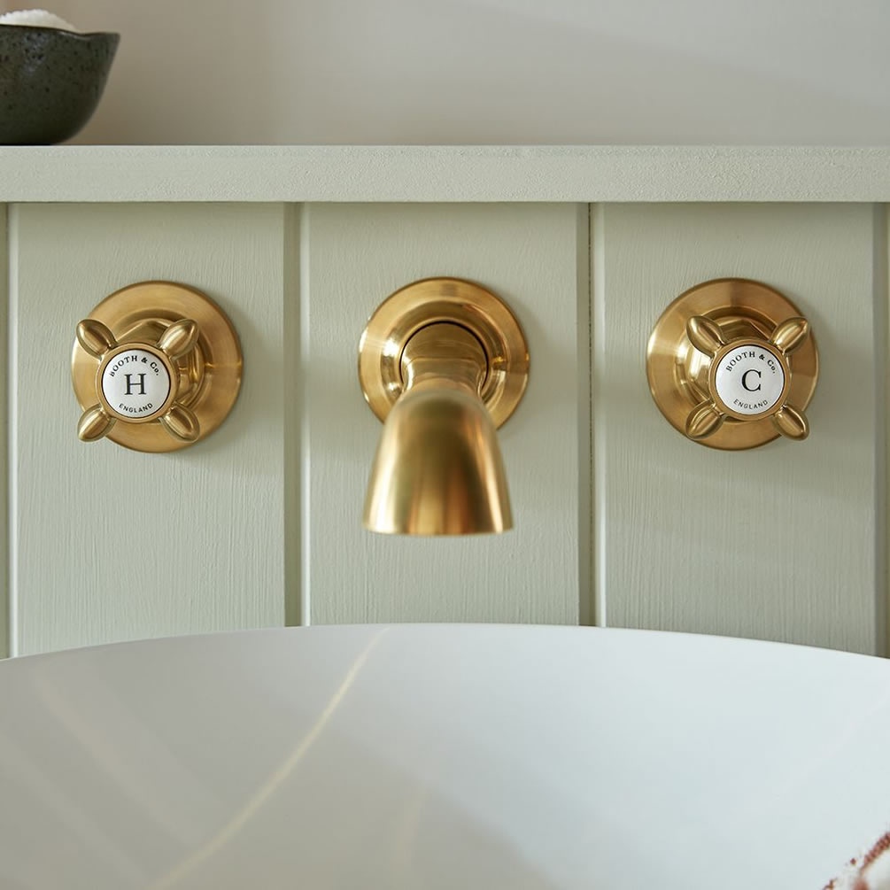 Booth & Co. Axbridge White Cross Brushed Brass Wall Mounted Basin Mixer - Lifestyle Image