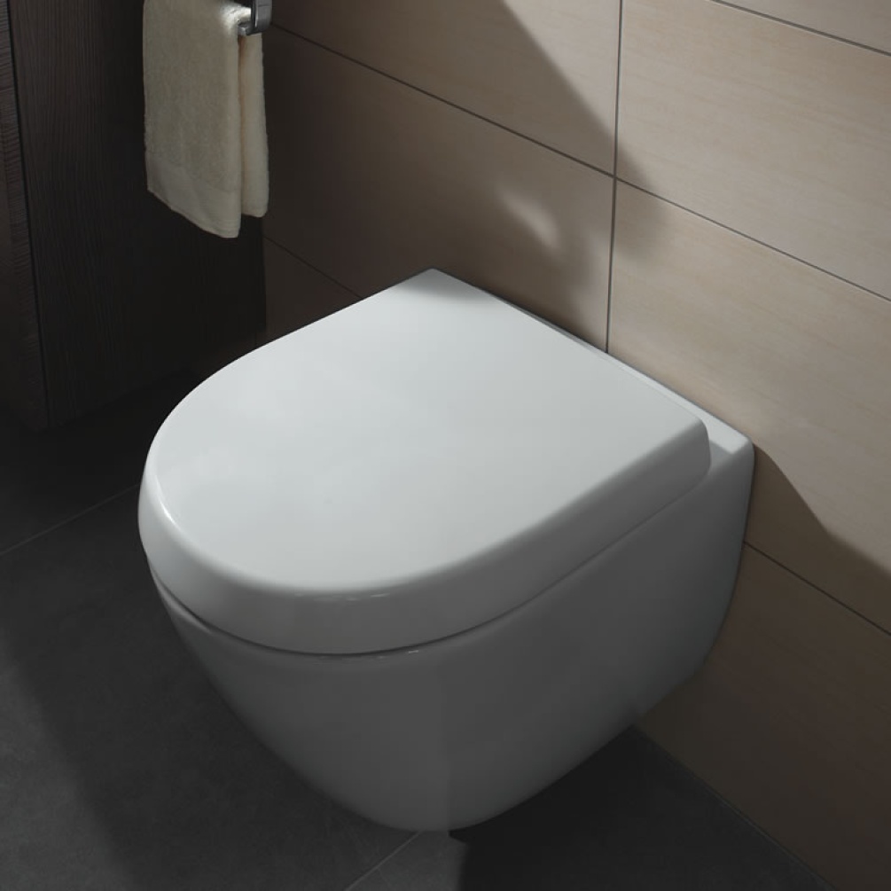 Lifestyle image of Villeroy & Boch Subway 2.0 Compact Rimless Wall-Hung WC against beige tiles.