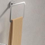 Lifestyle image of Origins Living Gedy Atena Towel Ring with orange towl.