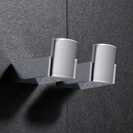 Lifestyle image of Origins Living Gedy Kent Hooks x2 mounted on dark grey textured tiles.