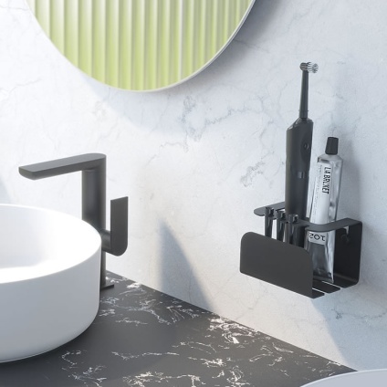 Lifestyle image of Origins Living Sonia Quick Electric Toothbrush Holder Black mounted on marble white wall.