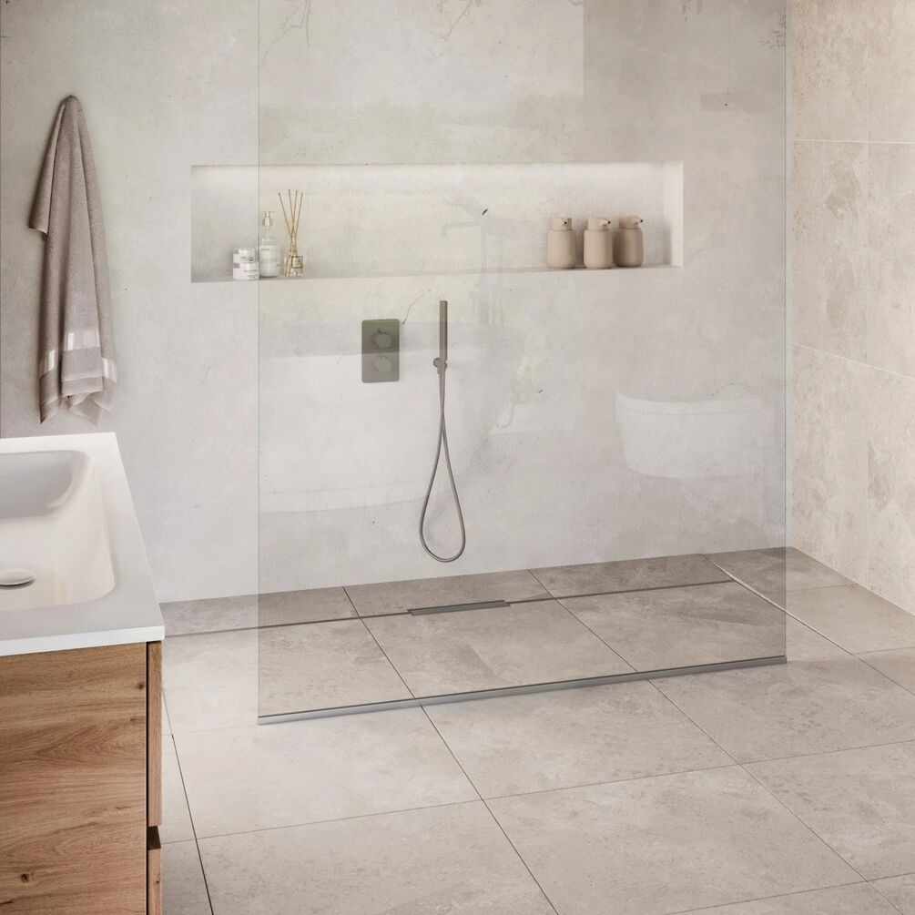 Lifestyle image of the Abacus Elements Linear Uno Stainless Steel Offset Drain Wetroom Former Kit