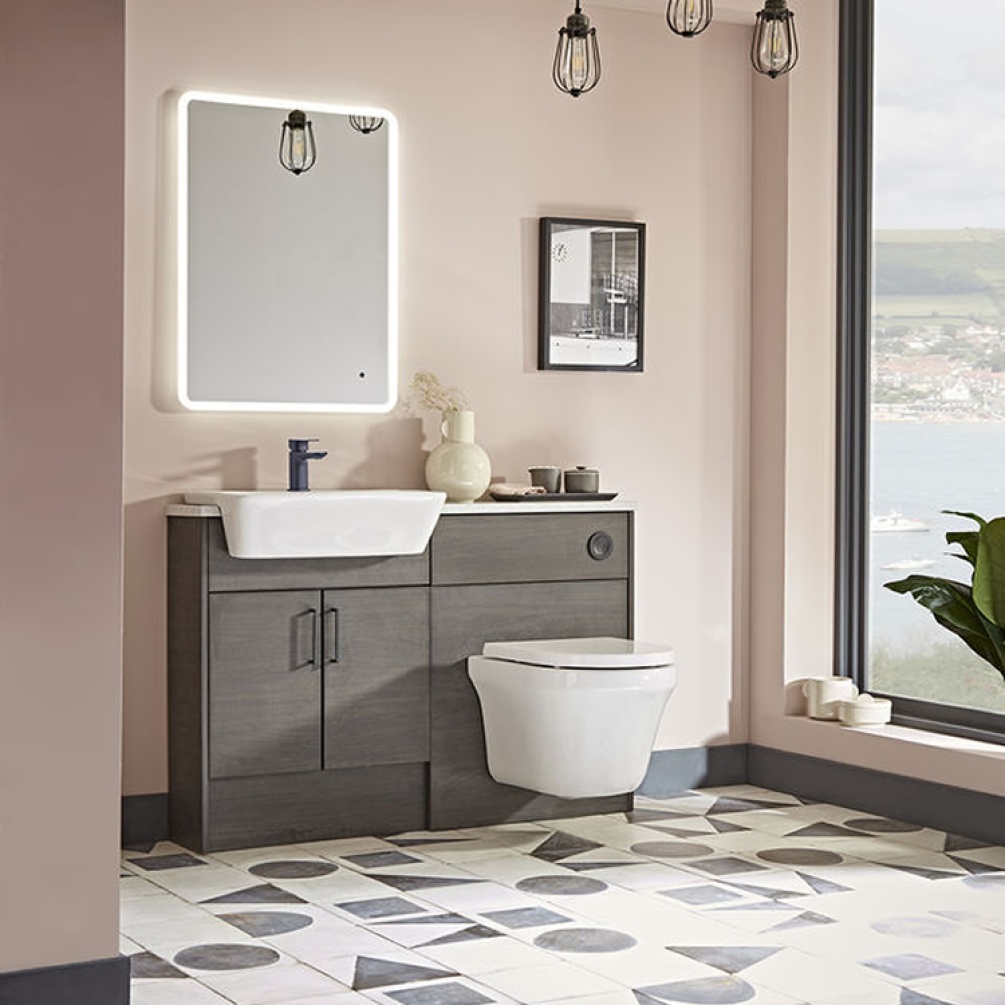 Product lifestyle image of the Tavistock Aerial Wall Hung Compact Toilet mounted against a vanity unit & basin
