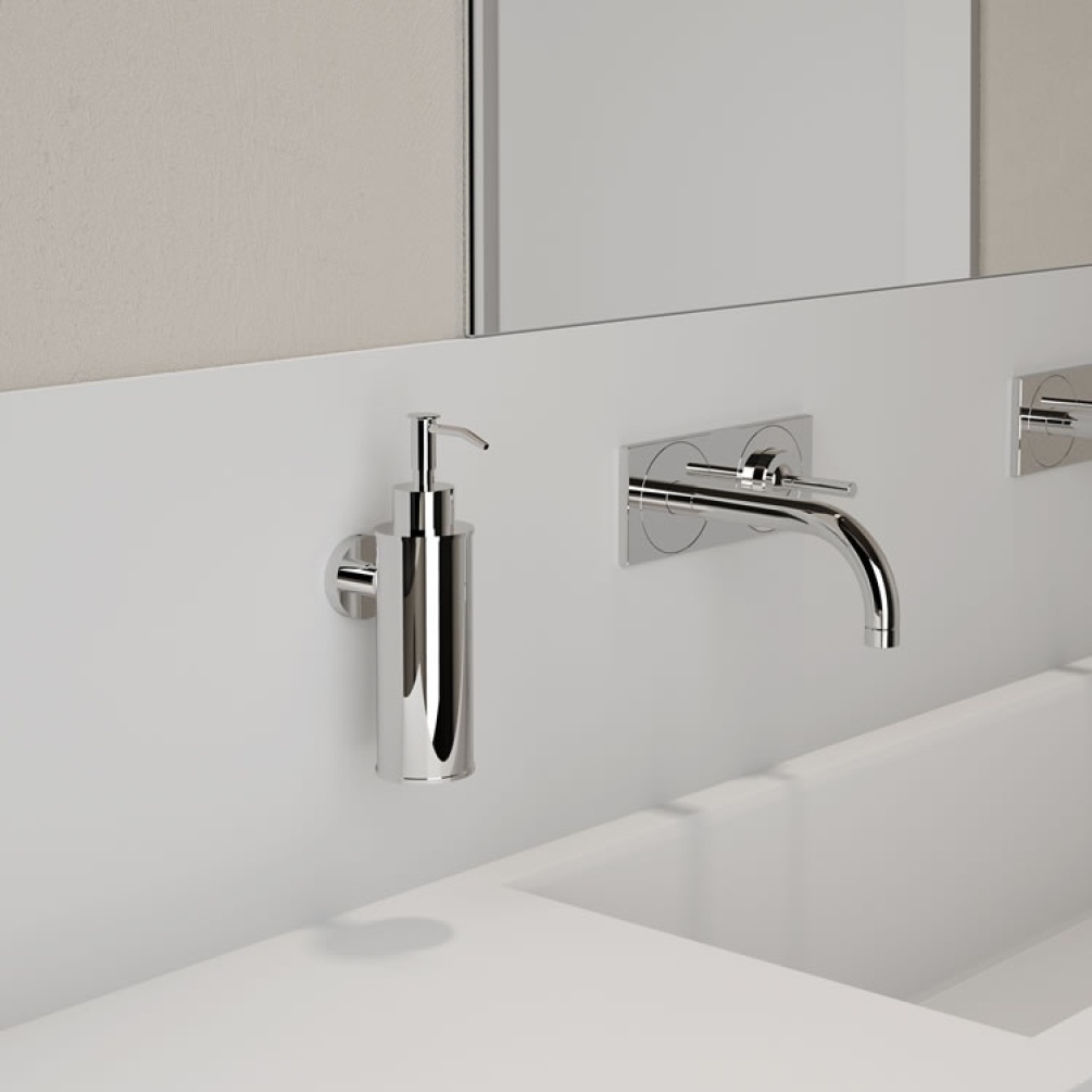 Lifestyle image of Origins Living Gedy Seal Round Soap Dispenser chrome mounted in white bathroom.